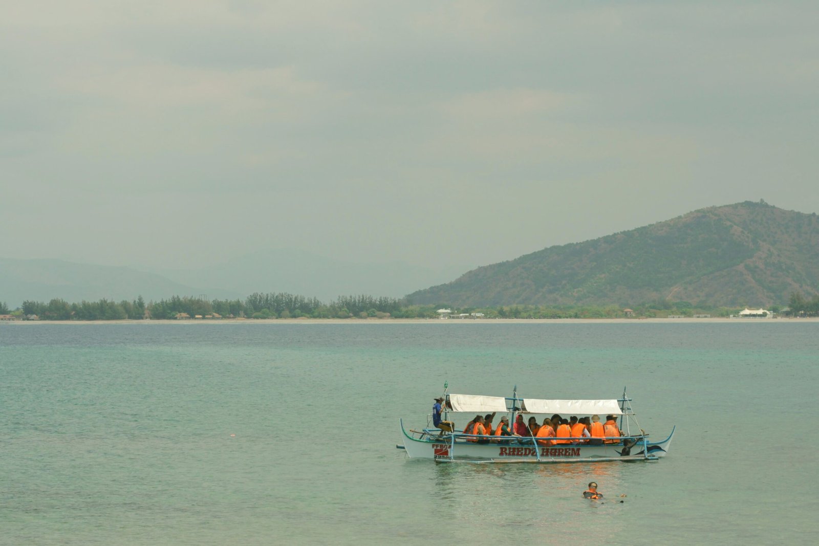 people riding on boat on sea during daytime