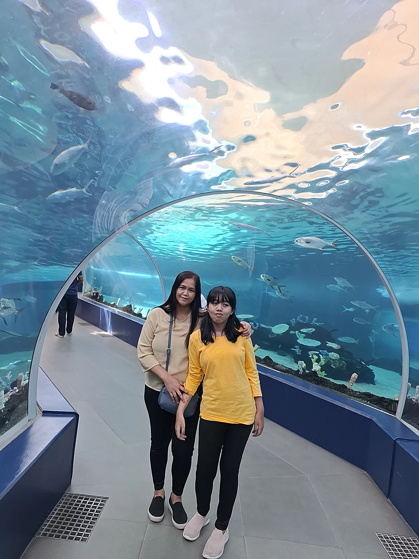 Maybel and daughter May Carl taking a photo together inside the ocean tunnel aquarium at Cebu Ocean Park