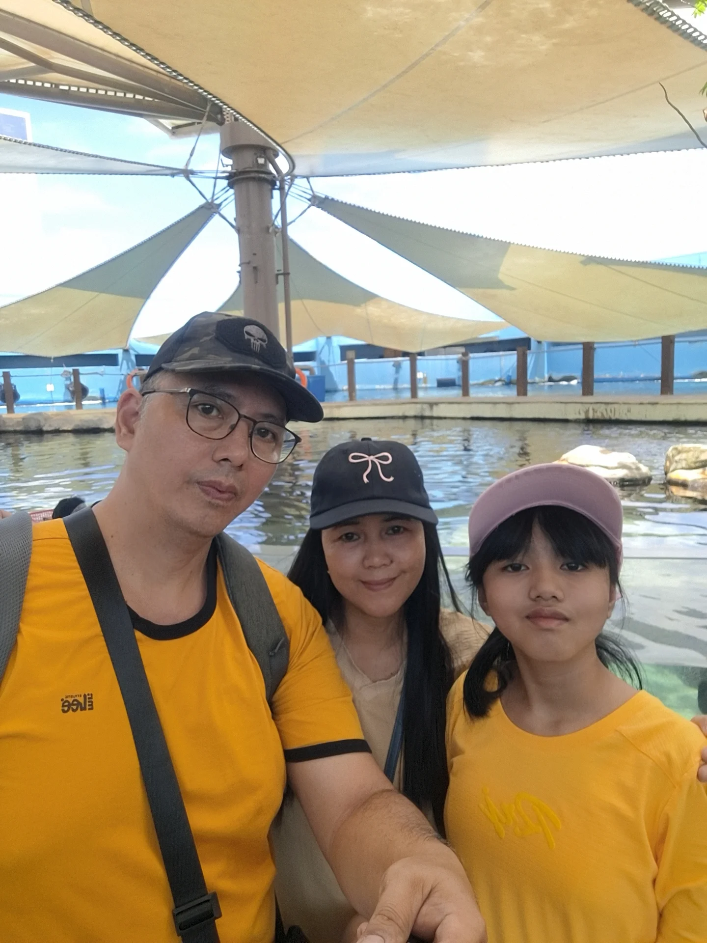 Giovanni Carlo Bagayas family selfie at the outdoor pier and pool area at Cebu Ocean Park overlooking the water