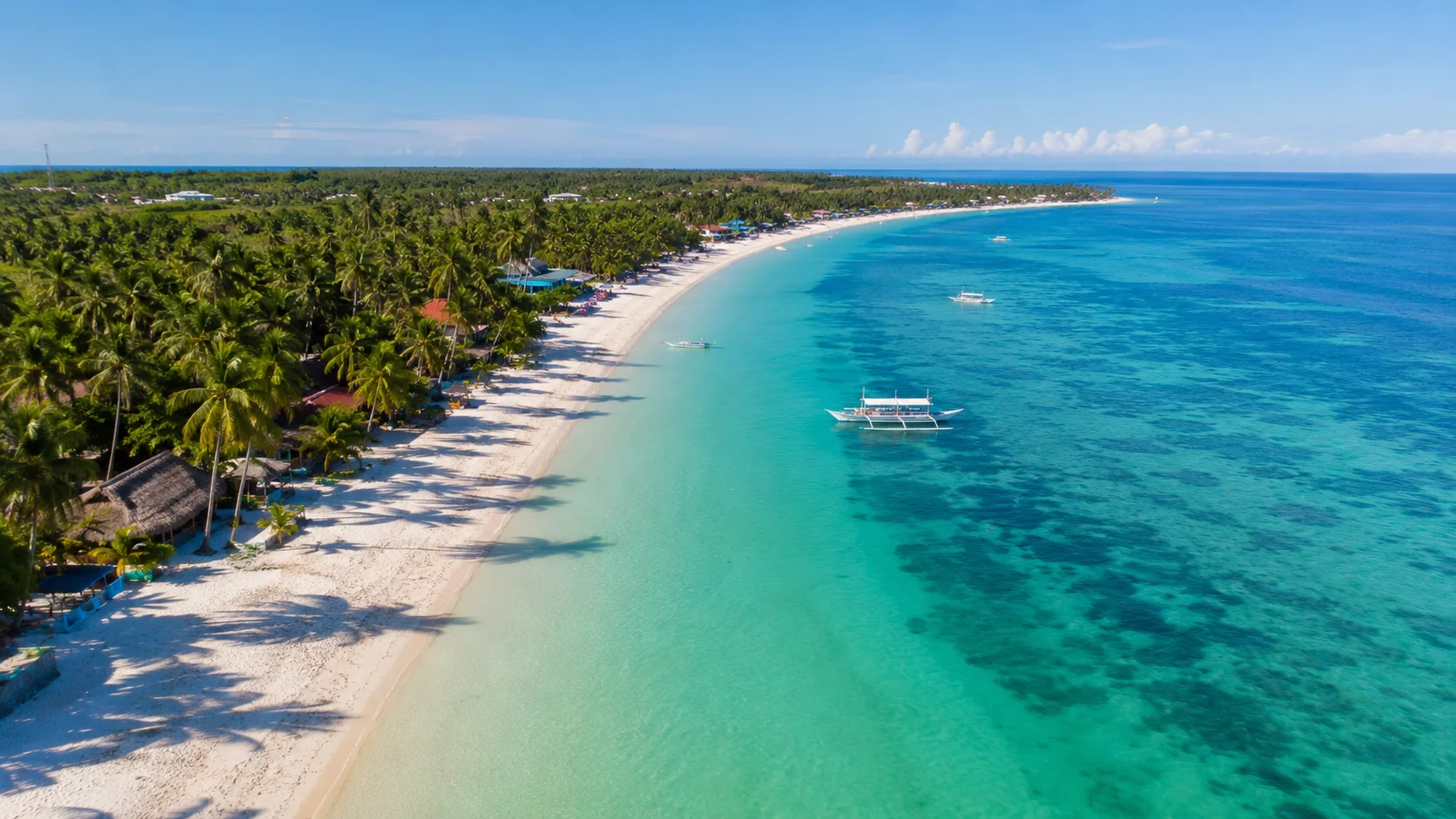 Bantayan Island Cebu Philippines — Kota Beach Santa Fe with powdery white sand beach and shallow turquoise water stretching to the horizon at sunrise