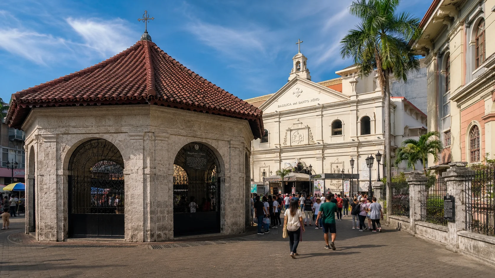 Cebu City Tour Guide 2026: Historical Sites, Highlands & Street Food 11 Cebu City tour Philippines — Magellan's Cross chapel and Basilica Minore del Santo Niño in downtown Cebu City with colorful tile rooftops and Spanish colonial architecture