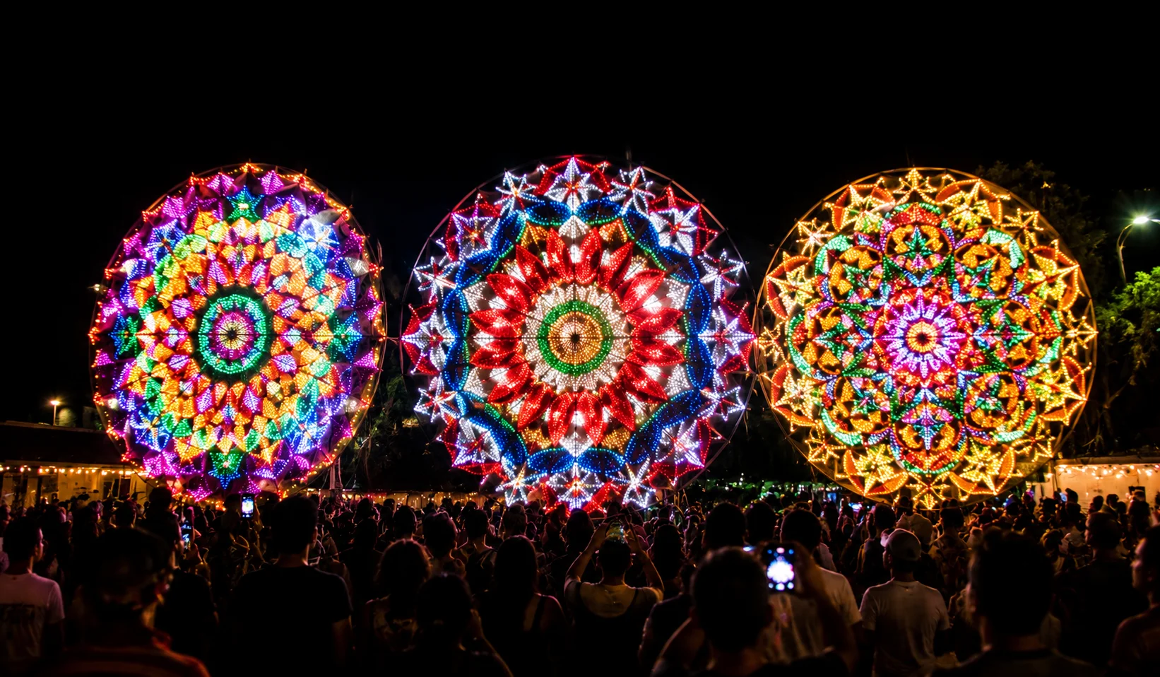 Giant Lantern Festival San Fernando Pampanga — enormous LED lanterns up to 20 feet in diameter performing synchronized kaleidoscopic light displays to music at night, the Christmas Capital of the Philippines