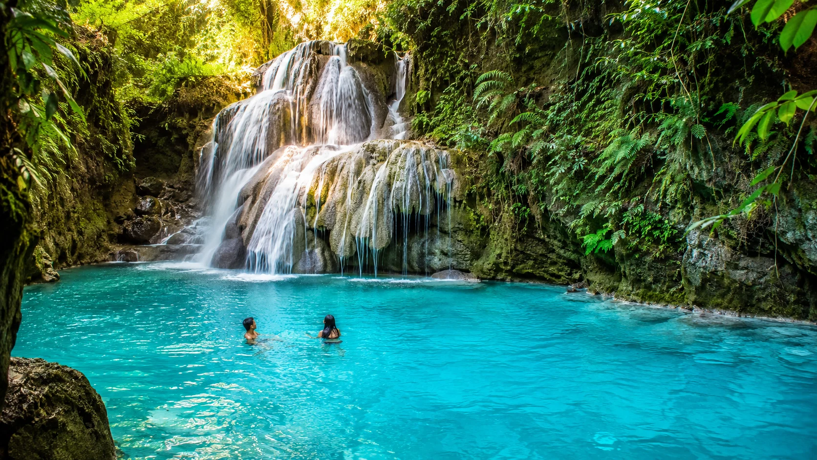 Kawasan Falls turquoise blue water pool Cebu — the Gatorade Factory turquoise color of the Kanlaob River spring water at the base of Kawasan Falls in Badian Cebu Philippines