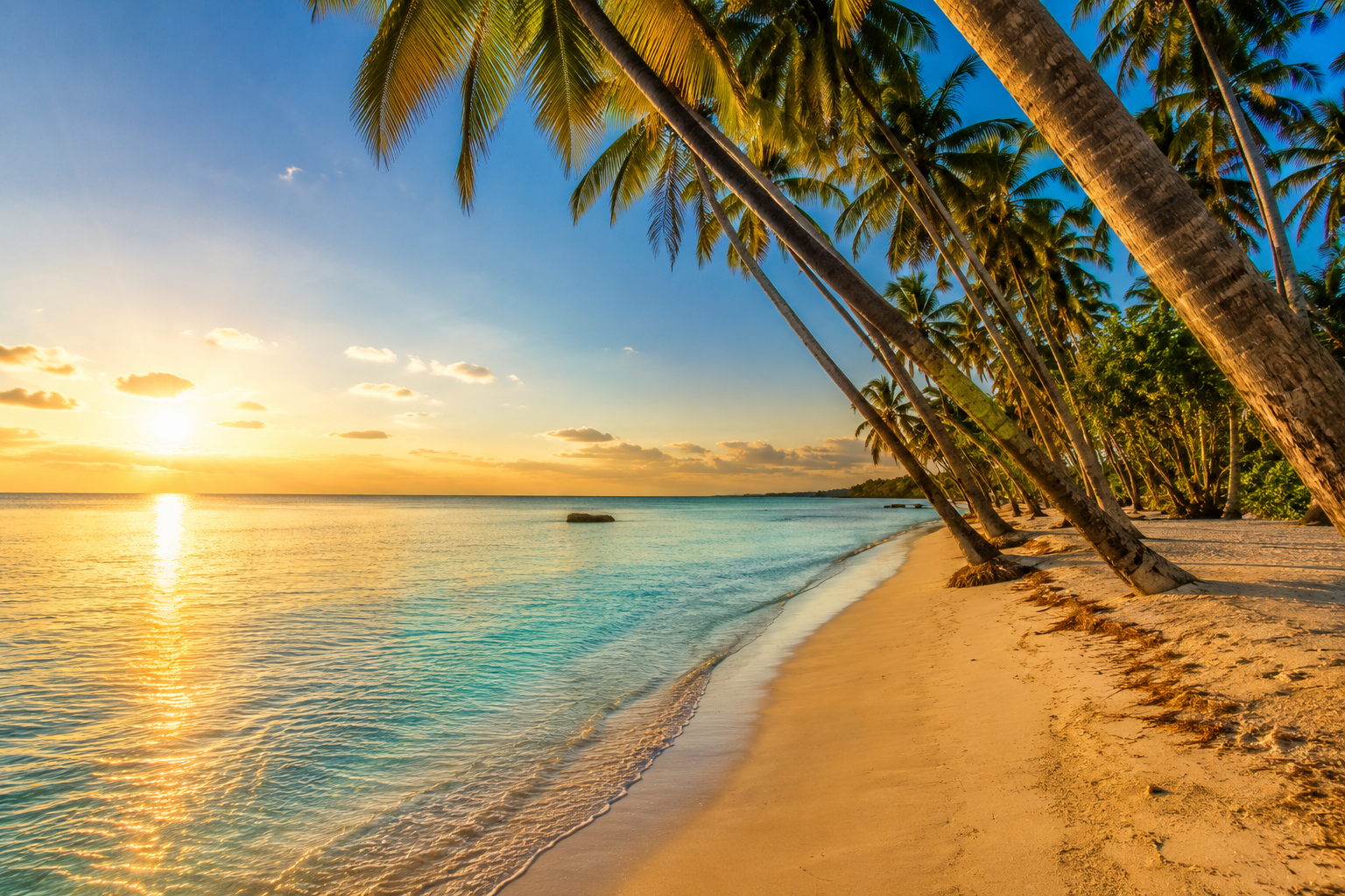Paliton Beach Siquijor at sunrise — white sand, calm turquoise water, and coconut palms with no crowds in the early morning