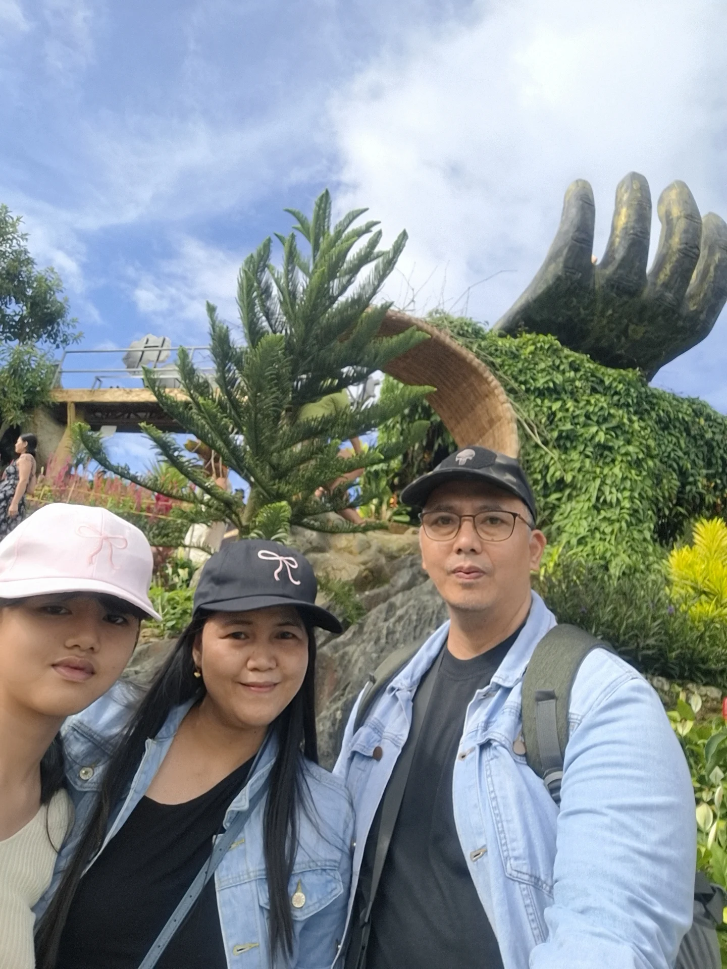 Sirao Flower Garden Cebu highlands — panoramic view of the celosia flower terraces with Cebu City visible in the valley below