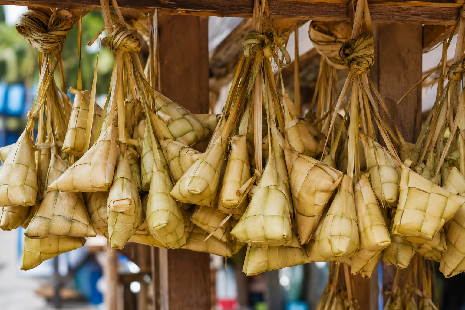 Bundles of Cebu puso hanging rice wrapped in coconut leaves
