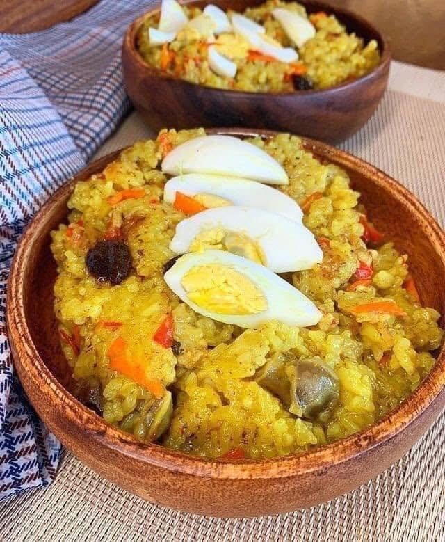 Pampanga delicacies Discover Flavors You Won't Find Anywhere Else: The Best of Kapampangan Cuisine 🇵🇭 12 Bringhe, Kapampangan sticky rice cooked in coconut milk and turmeric