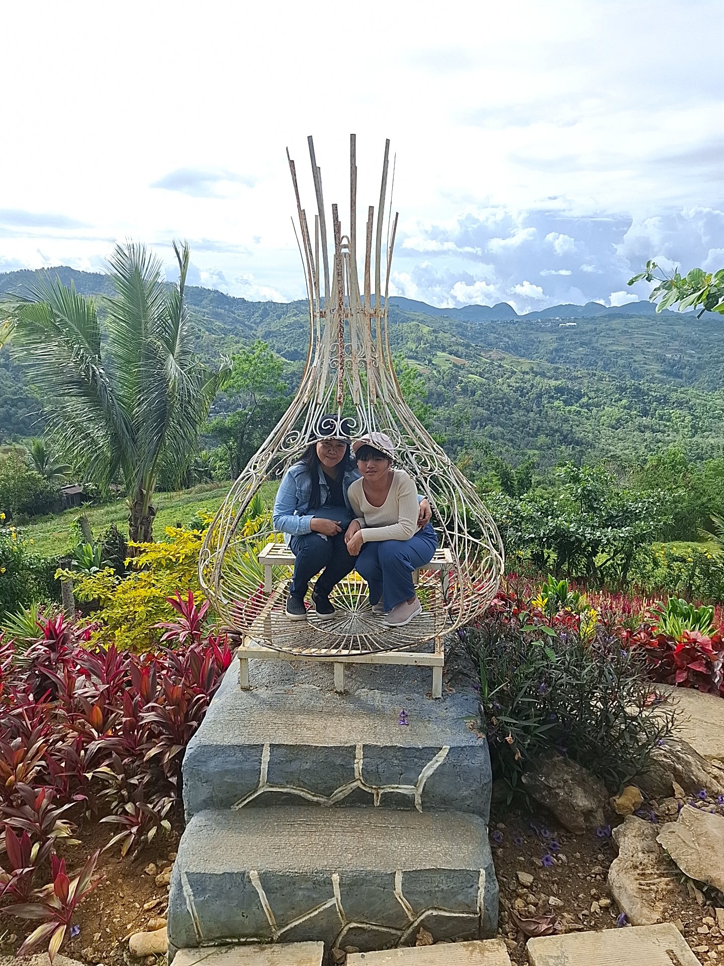 Wire chair photo spot overlooking the Cebu highlands at Sirao Garden